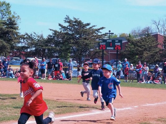 Players racing around the bases on opening day